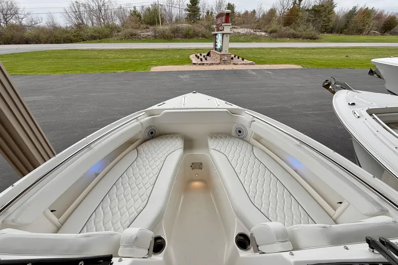 Slide: The Image of 2026 Pursuit DC 266 Dual Console boat with luxurious seating and modern design. - 23