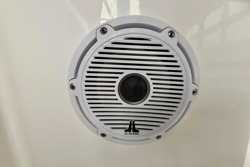 Slide: The Image of JL Audio speaker on 2026 Pursuit DC 266 Dual Console boat. - 30