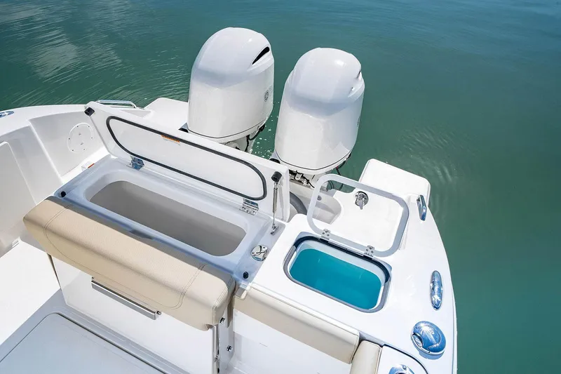 Slide: The Image of Manufacturer Provided Image: 2025 Pursuit DC 266 Dual Console boat with twin engines and open storage compartments. - 7