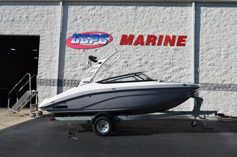 The Image of 2026 Yamaha Boats 195S on trailer at GSPS Marine dealership. - 1