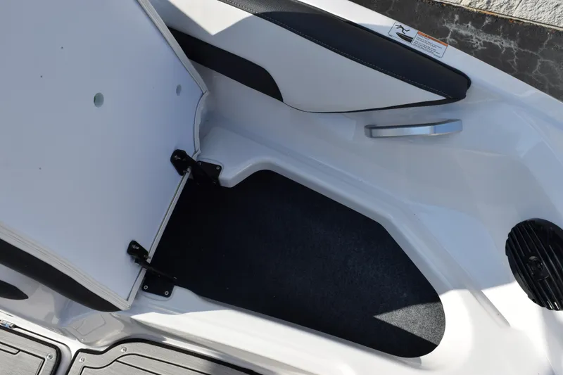 Slide: The Image of 2026 Yamaha Boats 195S interior storage compartment with open hatch. - 15