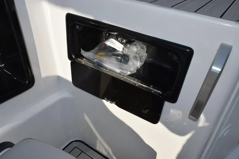Slide: The Image of Storage compartment on 2026 Yamaha Boats 195S, featuring sleek design and practical utility. - 16