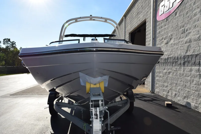 Slide: The Image of 2026 Yamaha Boats 195S on trailer, parked outside a building. - 3