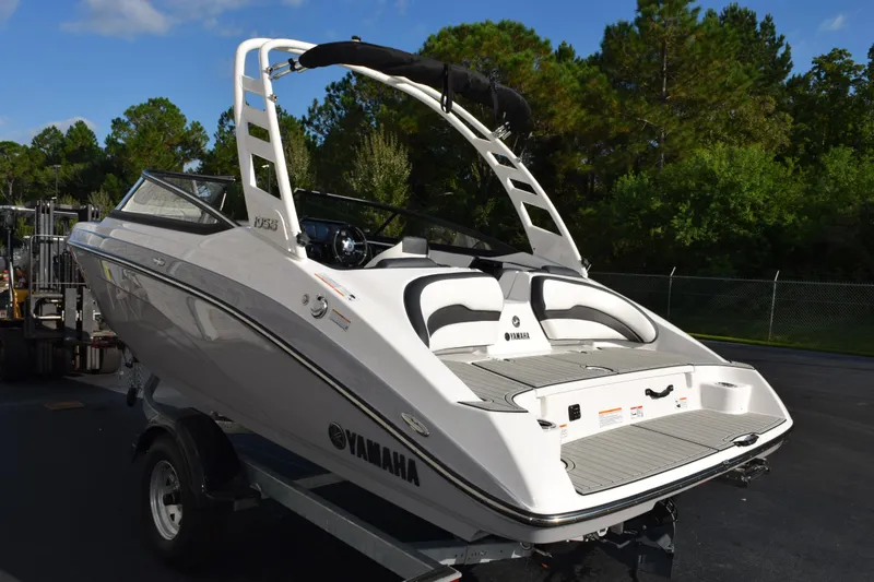 Slide: The Image of 2026 Yamaha Boats 195S on trailer, sleek design, outdoor setting. - 6