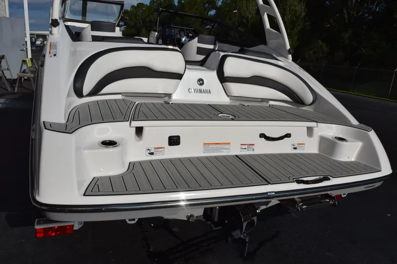 Slide: The Image of 2026 Yamaha Boats 195S rear view showcasing swim platform and seating area. - 7