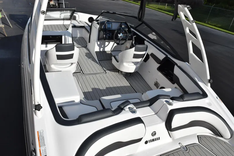 Slide: The Image of 2026 Yamaha Boats 195S interior with sleek seating and modern dashboard design. - 8