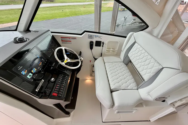 Slide: The Image of Interior of 2026 Pursuit DC 326 Dual Console with helm station. - 16