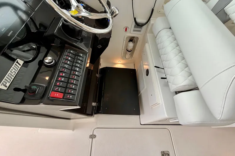Slide: The Image of Interior of Pursuit DC 326 Dual Console 2026 with helm console. - 19