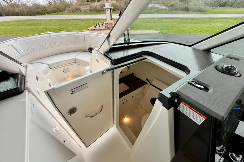 Slide: The Image of Interior view of Pursuit DC 326 Dual Console 2026. - 22