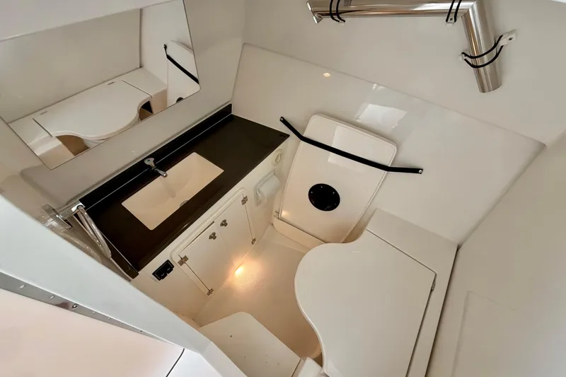 Slide: The Image of Interior of 2026 Pursuit DC 326 Dual Console with sink and storage. - 23