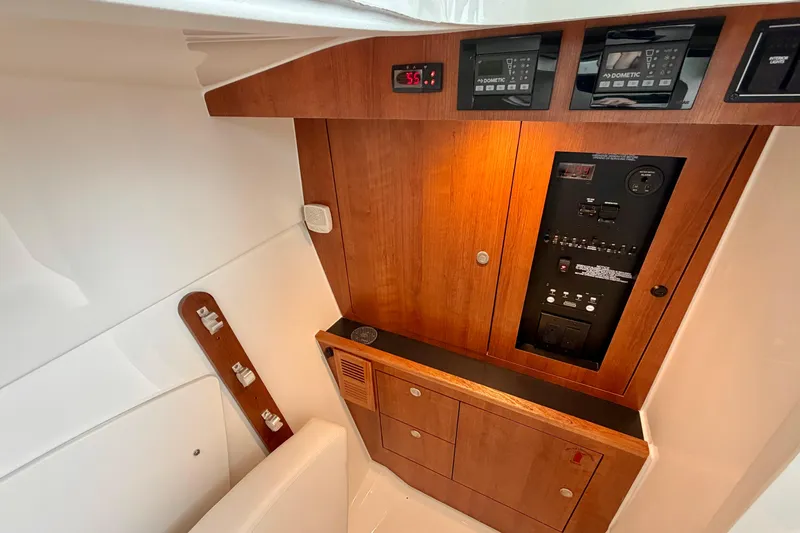 Slide: The Image of Interior view of Pursuit DC 326 Dual Console 2026 control panel. - 25