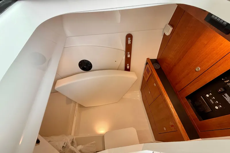 Slide: The Image of Interior of 2026 Pursuit DC 326 Dual Console with wooden cabinets. - 27
