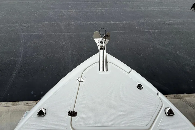 Slide: The Image of Bow view of 2026 Pursuit DC 246 Dual Console boat at dock. - 20