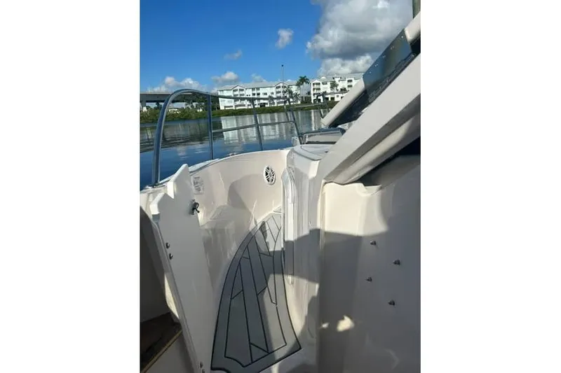 Slide: The Image of 2026 Solara S-310 SB boat interior with water and buildings in the background. - 14