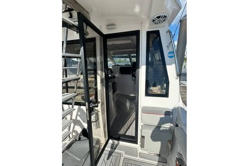 Slide: The Image of 2026 Solara S-310 SB boat interior with open glass door and modern design. - 8
