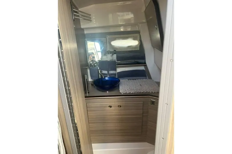 Slide: The Image of 2026 Solara S-310 SB interior bathroom with modern sink and wooden cabinetry. - 9