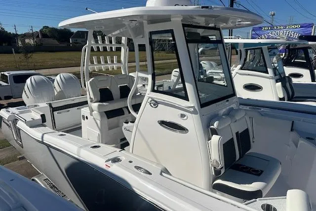 Slide: The Image of 2026 Tidewater 282 CC Adventure boat with dual engines and modern design. - 14