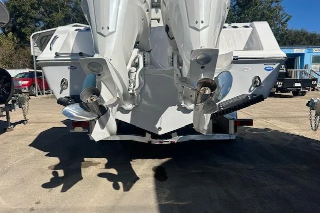 Slide: The Image of 2026 Tidewater 282 CC Adventure boat with dual outboard motors on a trailer. - 9