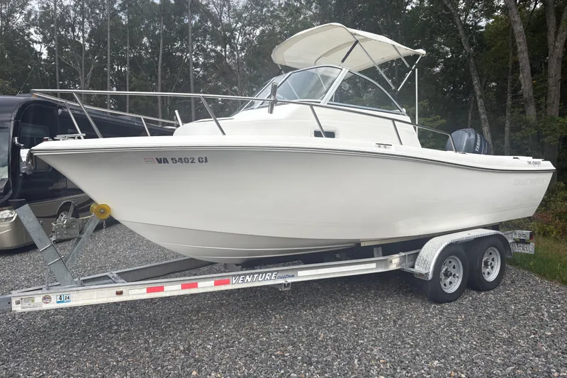 The Image of 2012 Clearwater 2100 WA boat on trailer, parked outdoors. - 1