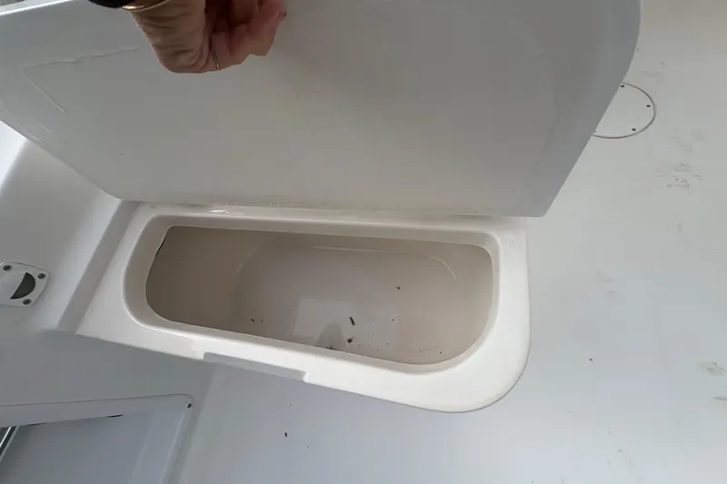 Slide: The Image of Open storage compartment on a 2012 Clearwater 2100 WA boat. - 11