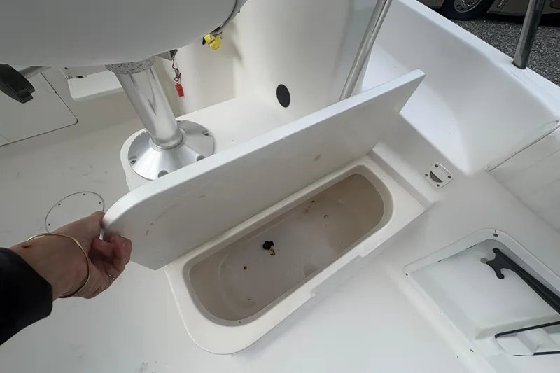 Slide: The Image of Open storage compartment on 2012 Clearwater 2100 WA boat deck. - 18