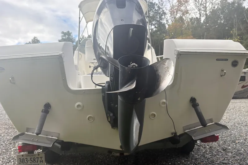 Slide: The Image of 2012 Clearwater 2100 WA boat stern with outboard motor and Virginia license plate. - 3