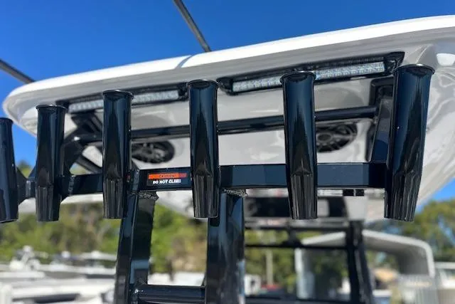 Slide: The Image of 2026 Tidewater 302 CC Adventure boat with rod holders and sleek design. - 11