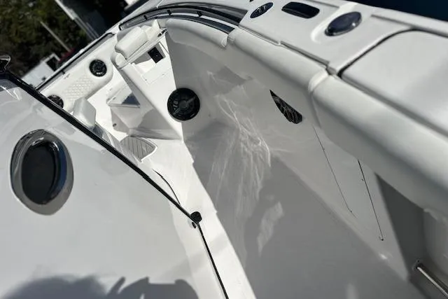 Slide: The Image of 2026 Tidewater 302 CC Adventure boat interior with sleek white design and modern features. - 12
