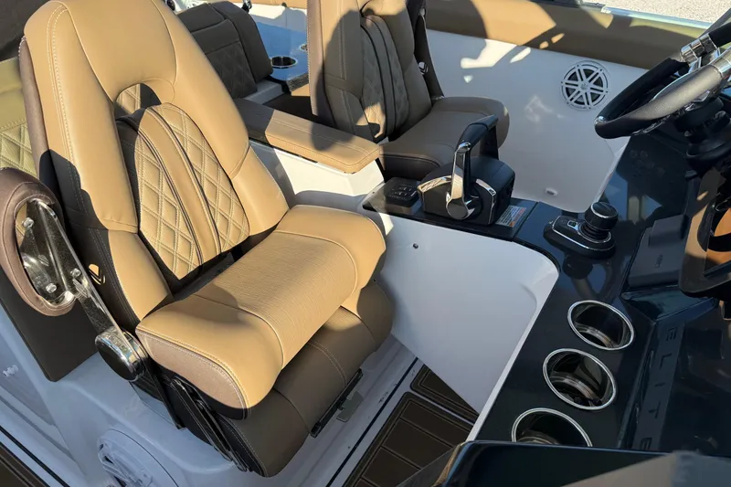 Slide: The Image of Luxurious interior of 2026 Monterey Elite 30 OB boat with tan leather seating. - 11