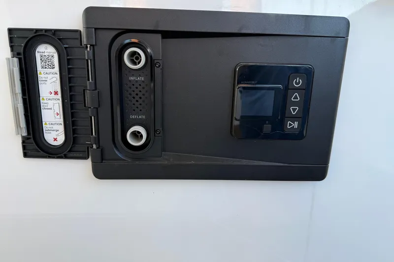 Slide: The Image of Control panel on 2026 Monterey Elite 30 OB boat with inflate and deflate options. - 14