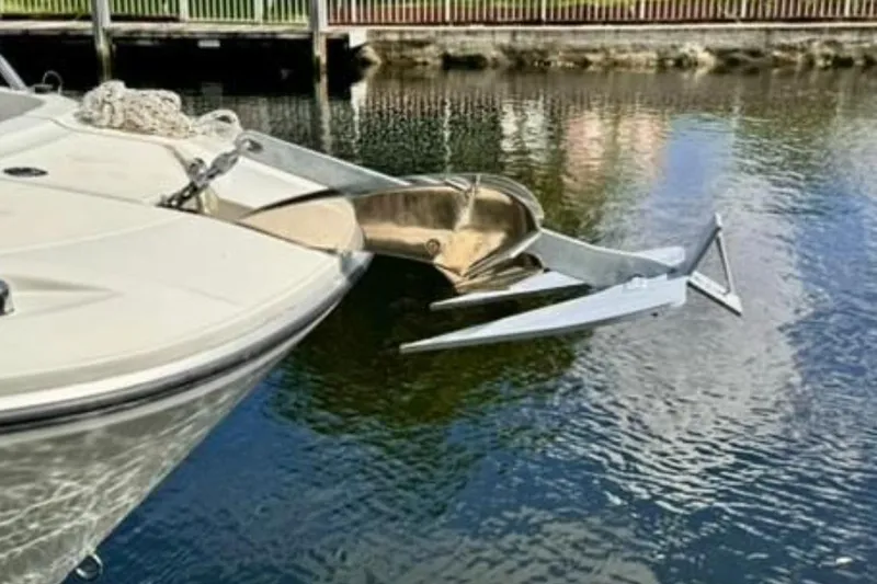 Slide: The Image of 2023 Jeanneau Leader 7.5 CC S3 boat with anchor in calm water. - 14