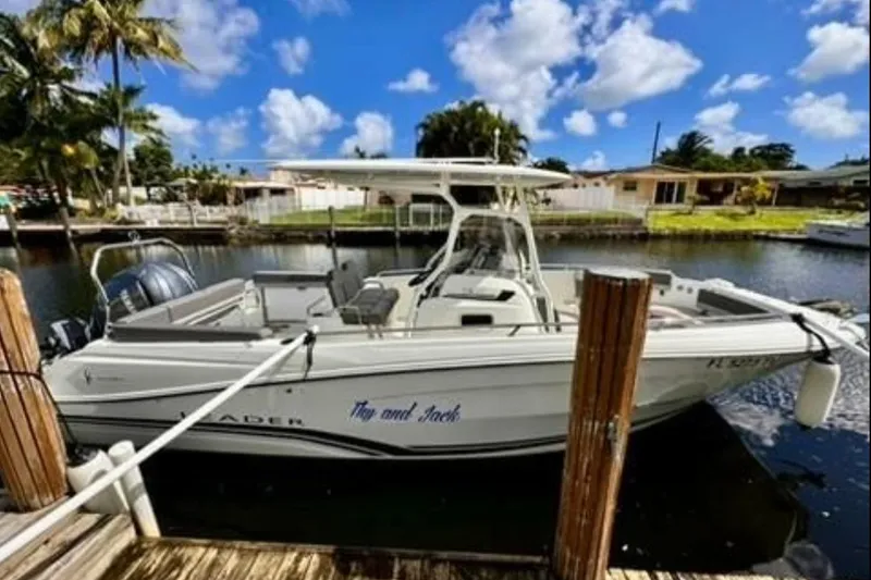 Slide: The Image of 2023 Jeanneau Leader 7.5 CC S3 boat docked by a canal under a blue sky. - 19