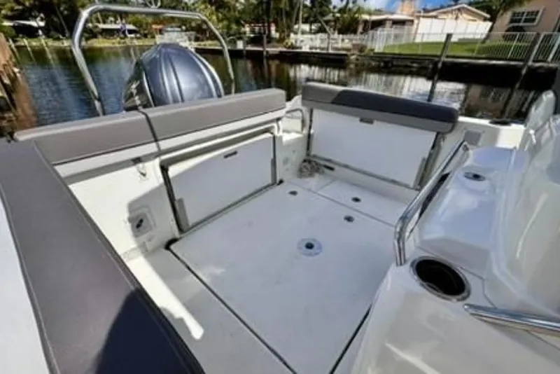 Slide: The Image of 2023 Jeanneau Leader 7.5 CC S3 boat interior with seating and storage. - 9