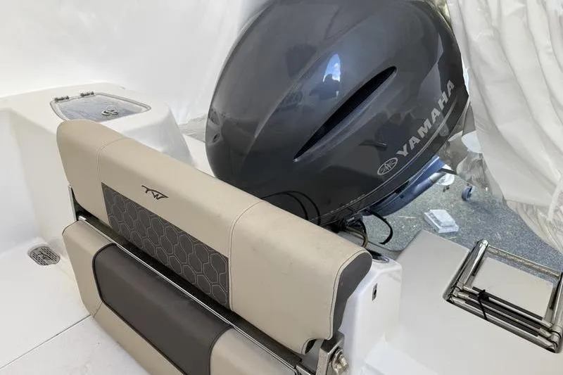 Slide: The Image of 2019 Tidewater 210 CC Adventure boat with Yamaha engine, featuring comfortable seating. - 10