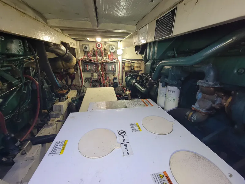 Slide: The Image of Engine room of 1998 Custom Carolina 45 Willis Boatworks, showcasing mechanical components. - 32