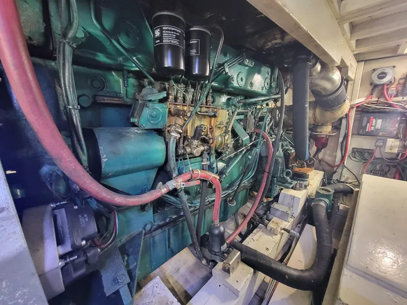 Slide: The Image of Engine room of 1998 Custom Carolina 45 Willis Boatworks, showcasing detailed machinery and components. - 34