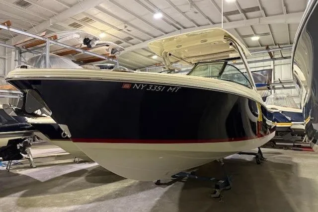The Image of 2023 Chris-Craft Calypso 28 boat in indoor storage, side view. - 0