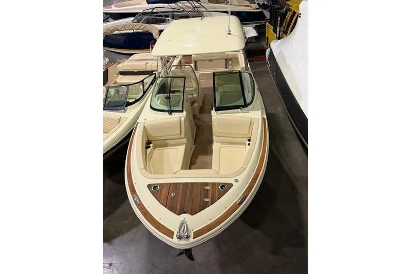 Slide: The Image of 2023 Chris-Craft Calypso 28 boat with elegant design and spacious seating. - 13