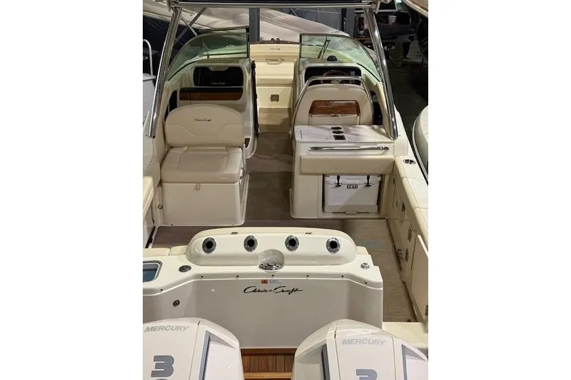 Slide: The Image of 2023 Chris-Craft Calypso 28 boat interior with seating and controls. - 15