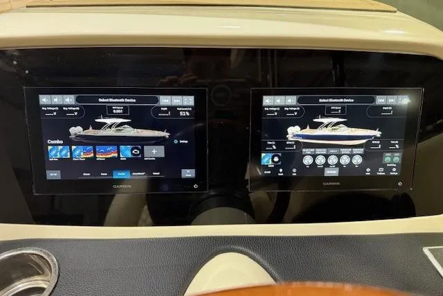 Slide: The Image of Dashboard of 2023 Chris-Craft Calypso 28 with dual Garmin displays showing boat controls. - 23
