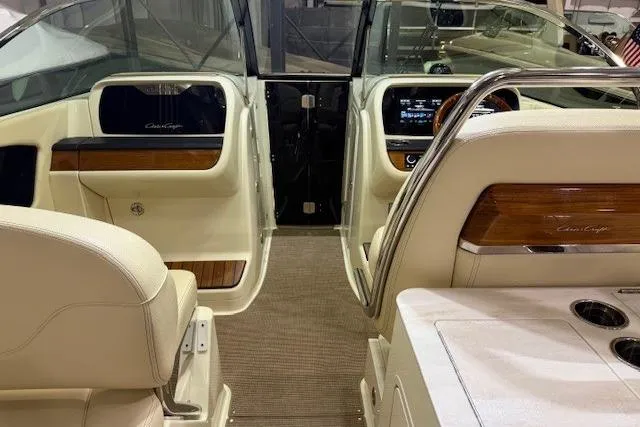 Slide: The Image of 2023 Chris-Craft Calypso 28 interior with luxurious seating and modern dashboard design. - 27
