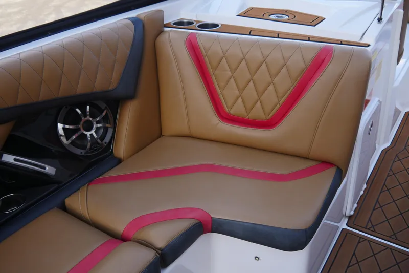 Slide: The Image of Luxurious 2017 Tigé RZX2 boat interior with tan and red diamond-stitched seating. - 13