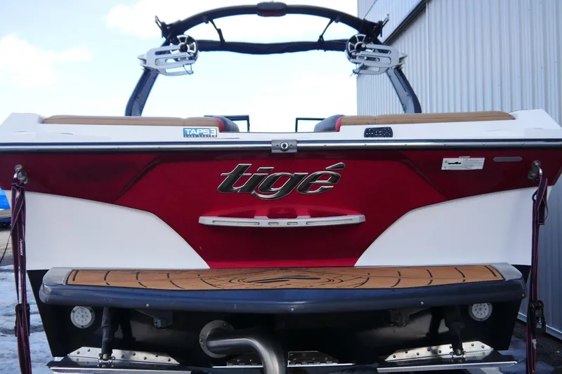 Slide: The Image of 2017 Tigé RZX2 boat rear view with red and white design. - 7