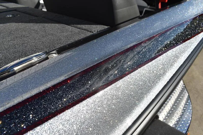 Slide: The Image of 2026 Triton 179 TrX boat with sparkling metallic finish and sleek design details. - 1