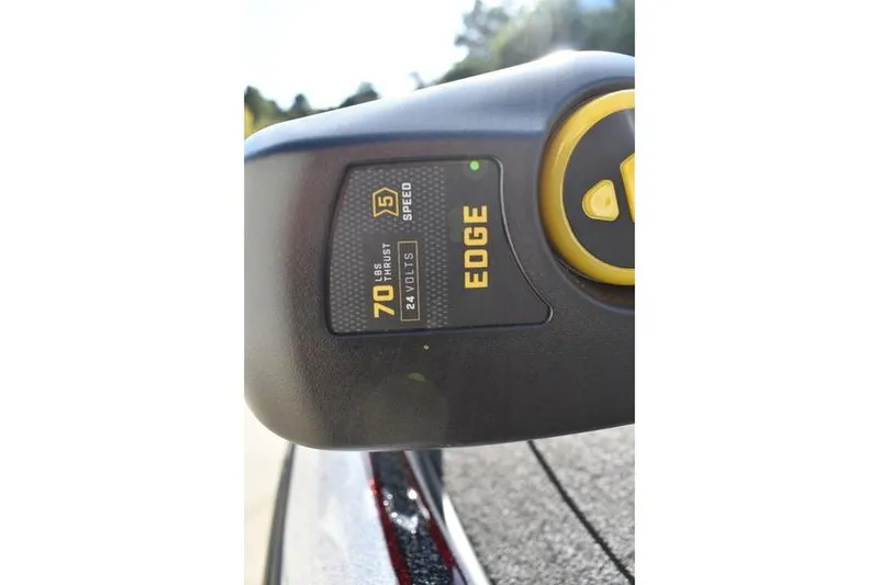 Slide: The Image of Close-up of a 2026 Triton 179 TrX boat control panel, showing 70 lbs thrust and 24 volts. - 11