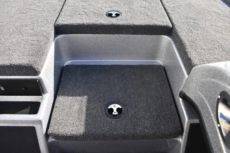 Slide: The Image of 2026 Triton 179 TrX boat deck with carpeted storage compartments. - 15