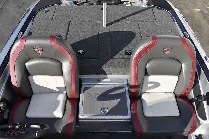Slide: The Image of 2026 Triton 179 TrX boat interior with dual seats and carpeted deck. - 18