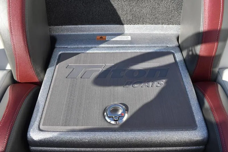 Slide: The Image of 2026 Triton 179 TrX boat seat with branded storage compartment. - 20