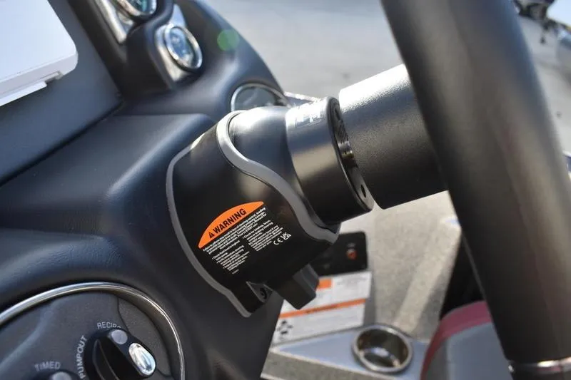 Slide: The Image of 2026 Triton 179 TrX steering wheel with warning label, close-up view. - 24