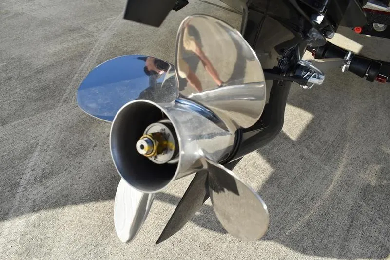 Slide: The Image of 2026 Triton 179 TrX boat propeller on concrete surface. - 3